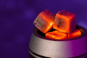 Burning hookah coals in hookah bowl close up photo